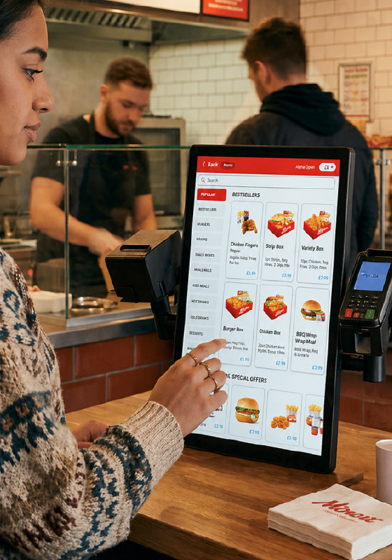 Customer using self-service kiosk
